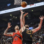 
              Toronto Raptors forward Juancho Hernangomez (41) and Cleveland Cavaliers forward Kevin love (0) compete for a rebound during the first half of an NBA basketball game Wednesday, Oct. 19, 2022, in Toronto. (Christopher Katsarov/The Canadian Press via AP)
            