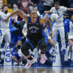 
              FILE - Kentucky's Dre'una Edwards (44) celebrates after making the winning shot to beat South Carolina in the NCAA women's college basketball Southeastern Conference tournament championship game Sunday, March 6, 2022, in Nashville, Tenn. The 2022-23 basketball season will include players getting paid and suiting up at new schools for the second consecutive year, all allowed now thanks to compensation deals and the transfer portal. All those players are aiming to make it to March Madness, the one-of-its-kind postseason free-for-all that might be the glue that holds together the increasingly fractured NCAA. (AP Photo/Mark Humphrey, File)
            