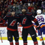 
              Carolina Hurricanes' Brent Burns (8) is congratulated on his goal by teammate Jordan Martinook, left, during the second period of an NHL hockey game against the New York Islanders in Raleigh, N.C., Friday, Oct. 28, 2022. (AP Photo/Karl B DeBlaker)
            