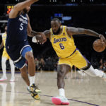 
              Los Angeles Lakers' LeBron James, right, drives against Minnesota Timberwolves' Kyle Anderson during first half of an NBA preseason basketball game Wednesday, Oct. 12, 2022, in Los Angeles. (AP Photo/Jae C. Hong)
            