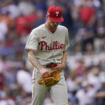 
              Philadelphia Phillies relief pitcher Connor Brogdon (75) leaves the field after being relieved during the fifth inning in Game 1 of a National League Division Series baseball game between the Atlanta Braves and the Philadelphia Phillies, Tuesday, Oct. 11, 2022, in Atlanta. (AP Photo/Brynn Anderson)
            