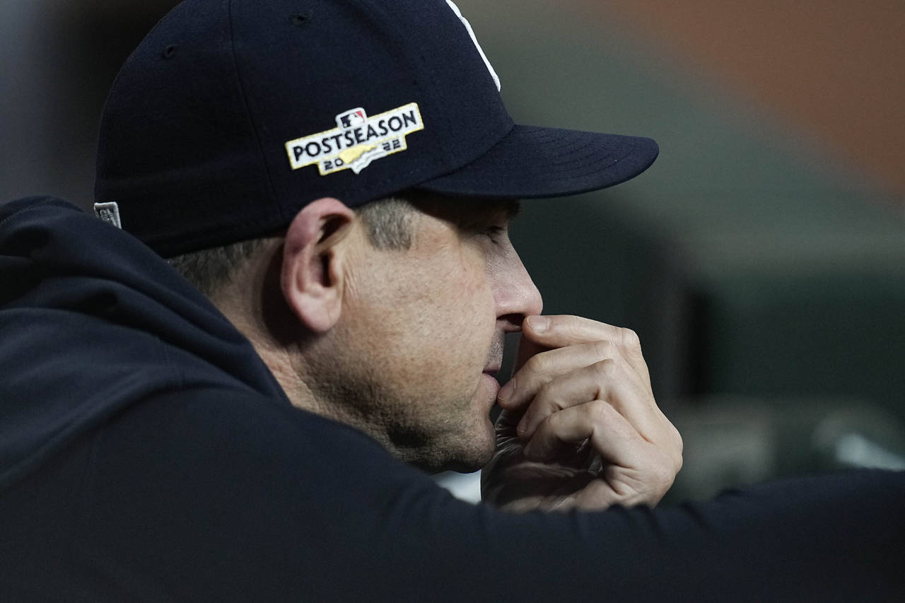 New York Yankees manager Aaron Boone watches play from the dugout during the ninth inning in Game 2...