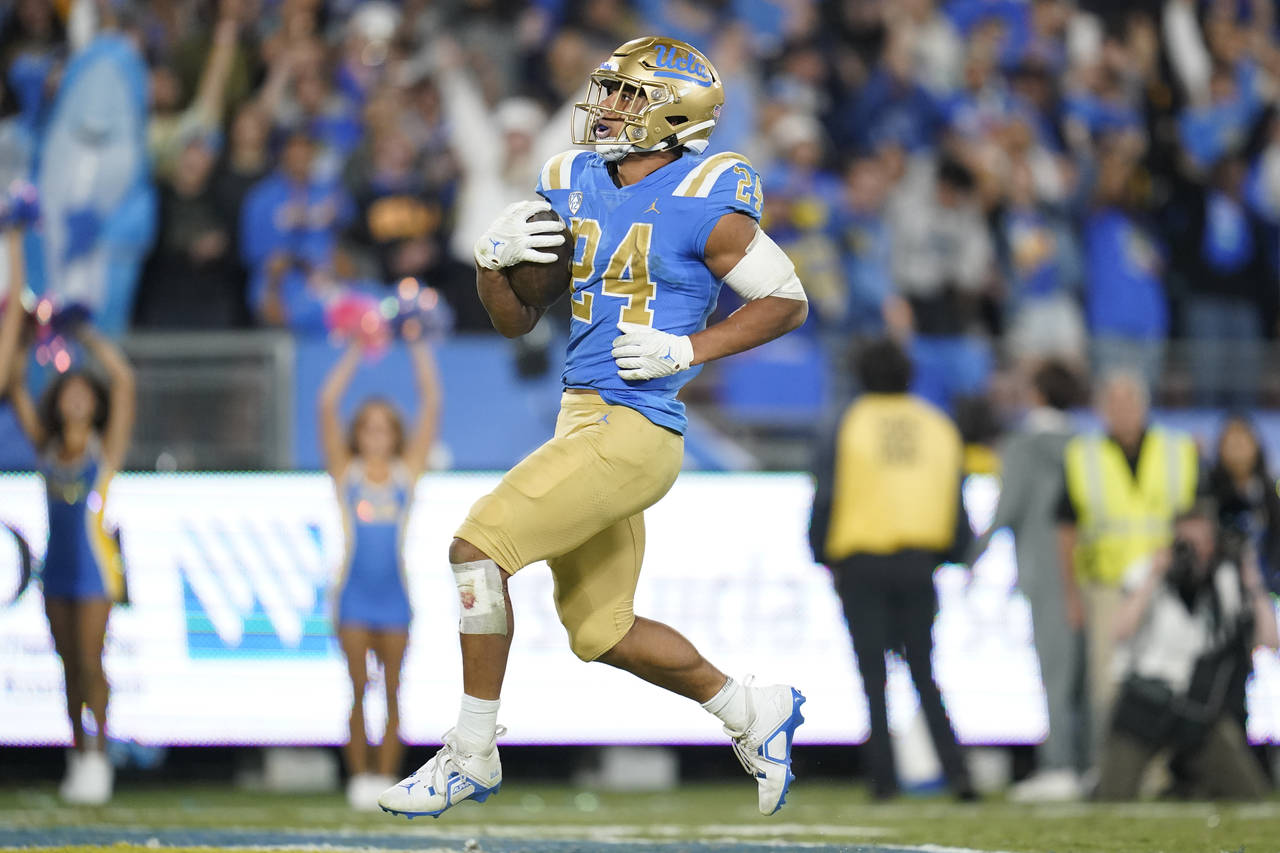 UCLA running back Zach Charbonnet (24) runs to the end zone for a touchdown during the second half ...
