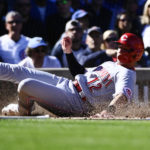 
              Cincinnati Reds' Spencer Steer scores against the Chicago Cubs during the third inning of a baseball game, in Chicago, Saturday, Oct. 1, 2022. (AP Photo/Matt Marton)
            