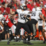 
              Vanderbilt quarterback AJ Swann (13) throws a pass in the first half of an NCAA college football game against Georgia, Saturday, Oct. 15, 2022, in Athens, Ga. (AP Photo/Brett Davis)
            