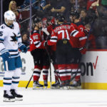 
              New Jersey Devils celebrate after scoring a goal against the San Jose Sharks during the second period of an NHL hockey game, Saturday, Oct. 22, 2022 in Newark, N.J. (AP Photo/Noah K. Murray)
            