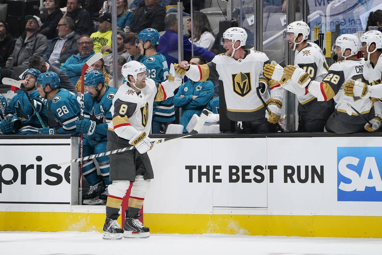 Vegas Golden Knights center Phil Kessel (8) celebrates with teammates after scoring against the San...