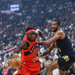 
              Toronto Raptors forward Pascal Siakam (43) drives past Cleveland Cavaliers center Evan Mobley (4) during the first half of an NBA basketball game Wednesday, Oct. 19, 2022, in Toronto. (Christopher Katsarov/The Canadian Press via AP)
            