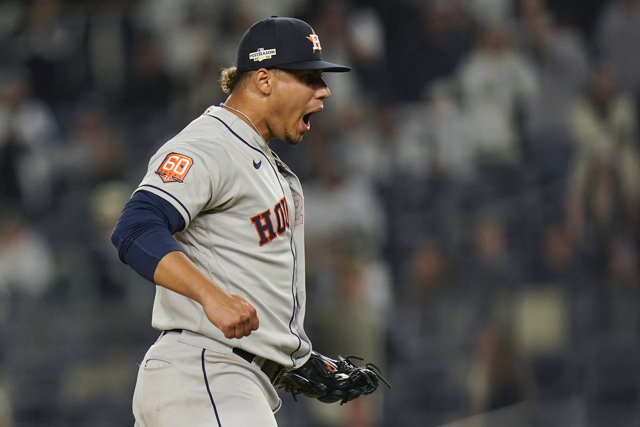 Houston Astros relief pitcher Bryan Abreu (52) reacts after striking out the New York Yankees to en...