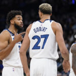 
              Minnesota Timberwolves center Karl-Anthony Towns, left, talks with center Rudy Gobert during the second half of the team's NBA basketball game against the Oklahoma City Thunder, Wednesday, Oct. 19, 2022, in Minneapolis. (AP Photo/Abbie Parr)
            