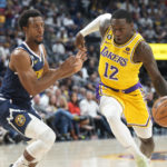 
              Los Angeles Lakers guard Kendrick Nunn, right, drives past Denver Nuggets guard Ish Smith in the second half of an NBA basketball game Wednesday, Oct. 26, 2022, in Denver. (AP Photo/David Zalubowski)
            
