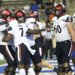 
              Cincinnati's Corey Kiner celebrates a second-quarter touchdown against Tulsa with teammates during an NCAA college football game in Tulsa, Okla., Saturday, Oct. 1, 2022. (AP Photo/Dave Crenshaw)
            