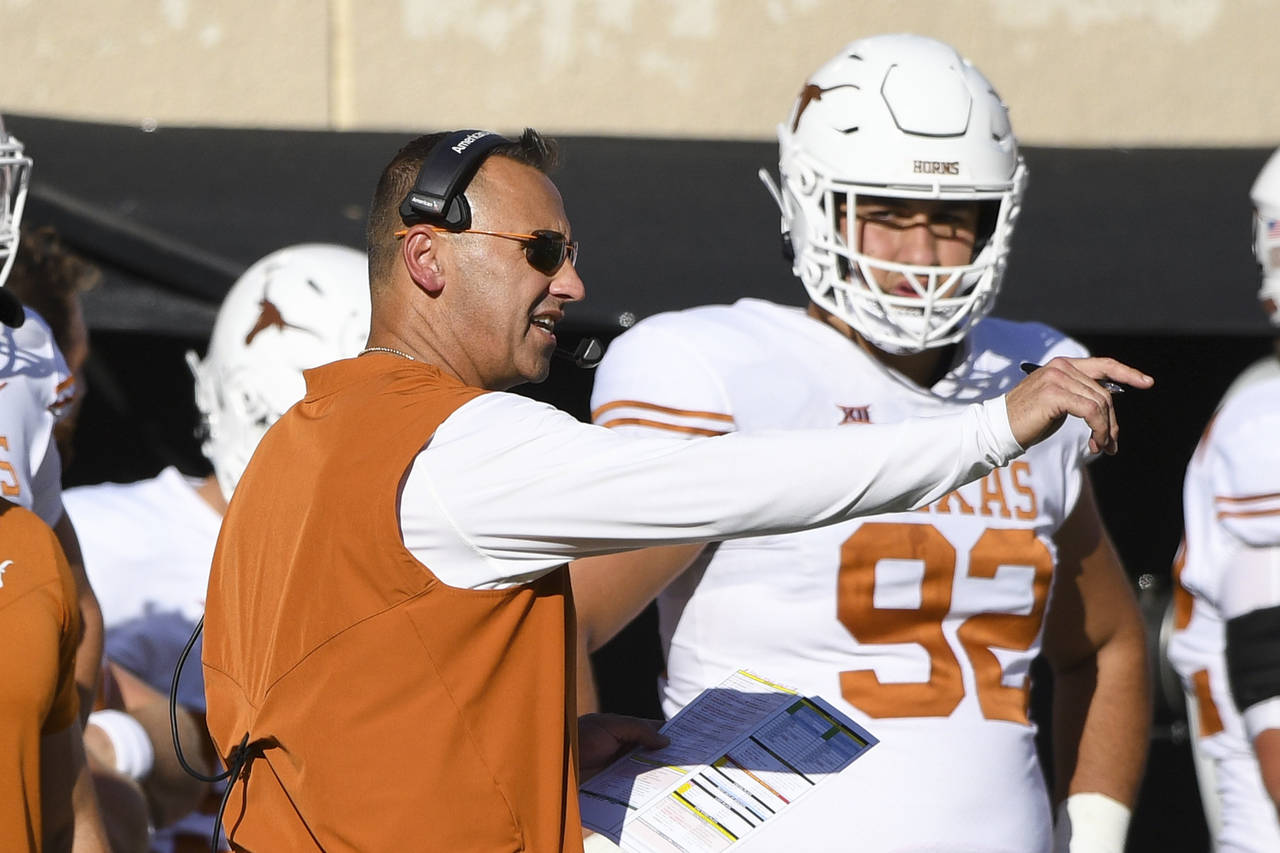 Texas tight end Andrej Karic (92) watches as head coach Steve Sarkisian gestures while speaking on ...
