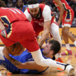 
              New Orleans Pelicans guard Dyson Daniels (11) strips the ball from Dallas Mavericks guard Luka Doncic in the first half of an NBA basketball game in New Orleans, Tuesday, Oct. 25, 2022. (AP Photo/Gerald Herbert)
            