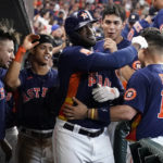 
              Houston Astros designated hitter Yordan Alvarez, center, celebrates with teammates after he hit a two-run home run against the Seattle Mariners during the sixth inning in Game 2 of an American League Division Series baseball game in Houston, Thursday, Oct. 13, 2022. (AP Photo/David J. Phillip)
            