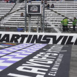 
              Ross Chastain walks the track before practice for the NASCAR Cup Series auto race at Martinsville Speedway, Saturday, Oct. 29, 2022, in Martinsville, Va. (AP Photo/Chuck Burton)
            