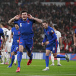 
              FILE - England's Harry Maguire celebrates after he scores his side's first goal during the World Cup 2022 group I qualifying soccer match between England and Albania at Wembley stadium in London, Friday, Nov. 12, 2021. (AP Photo/Ian Walton, File)
            