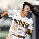 
              San Diego Padres' Ha-Seong Kim scores on a hit by Austin Nola during the fifth inning in Game 2 of the baseball NL Championship Series between the San Diego Padres and the Philadelphia Phillies on Wednesday, Oct. 19, 2022, in San Diego. (AP Photo/Gregory Bull)
            