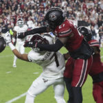 
              South Carolina defensive back DQ Smith (27) deflects a pass intended for Texas A&M wide receiver Moose Muhammad III (7) during the second half of an NCAA college football game on Saturday, Oct. 22, 2022, in Columbia, S.C. (AP Photo/Artie Walker Jr.)
            