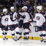 
              Columbus Blue Jackets defenseman Andrew Peeke (2) celebrates with teammates after scoring a goal against the New York Rangers during the second period of an NHL hockey game, Sunday, Oct. 23, 2022, in New York. (AP Photo/Noah K. Murray)
            