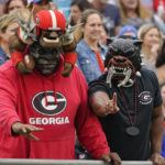 
              Georgia fans cheer on their team during the first half of an NCAA college football game against Florida, Saturday, Oct. 29, 2022, in Jacksonville, Fla. (AP Photo/John Raoux)
            