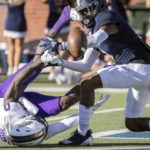 
              James Madison wide receiver Terrance Greene Jr., left, has his catch broken up by Georgia Southern defensive back Wylan Free, right, in the end zone during the first half of an NCAA football game, Saturday, Oct. 15, 2022, in Statesboro, Ga. (AP Photo/Stephen B. Morton)
            