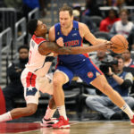 
              Washington Wizards guard Bradley Beal (3) reaches for the ball against Detroit Pistons forward Bojan Bogdanovic, right, during the first half of an NBA basketball game, Tuesday, Oct. 25, 2022, in Washington. (AP Photo/Nick Wass)
            