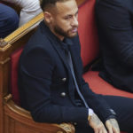 
              Former FC Barcelona player Neymar who now plays for Paris Saint-Germain sits in court in Barcelona, Spain, Monday Oct. 17, 2022. Neymar is in court to face a trial over alleged irregularities involving his transfer to Barcelona in 2013. Neymar's parents, former Barcelona president Sandro Rosell and representatives for both the Spanish club and Brazilian team Santos are also in court after a complaint brought by Brazilian investment group DIS regarding the amount of the player's transfer. All defendants have denied wrongdoing. (AP Photo/Joan Mateu Parra)
            
