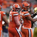 
              Syracuse quarterback Carlos Del Rio-Wilson, right, reacts to missing a fourth down conversion against Notre Dame during the second half of an NCAA college football game in Syracuse, N.Y., Saturday, Oct. 29, 2022. (AP Photo/Adrian Kraus)
            