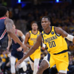 
              Indiana Pacers' Bennedict Mathurin (00) is defended by Washington Wizards' Bradley Beal during the second half of an NBA basketball game Wednesday, Oct. 19, 2022, in Indianapolis. (AP Photo/Michael Conroy)
            