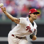 
              Philadelphia Phillies starting pitcher Aaron Nola (27) throws during the fourth inning in Game 3 of baseball's National League Division Series against the Atlanta Braves, Friday, Oct. 14, 2022, in Philadelphia. (AP Photo/Matt Slocum)
            