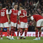 
              Arsenal's players celebrate after winning the English Premier League soccer match between Arsenal and Liverpool at Emirates Stadium in London, Sunday, Oct. 9, 2022. Arsenal won 3-2. (AP Photo/Rui Vieira)
            