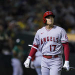 
              Los Angeles Angels' Shohei Ohtani walks to the dugout after striking out against the Oakland Athletics during the eighth inning of a baseball game in Oakland, Calif., Tuesday, Oct. 4, 2022. (AP Photo/Godofredo A. Vásquez)
            