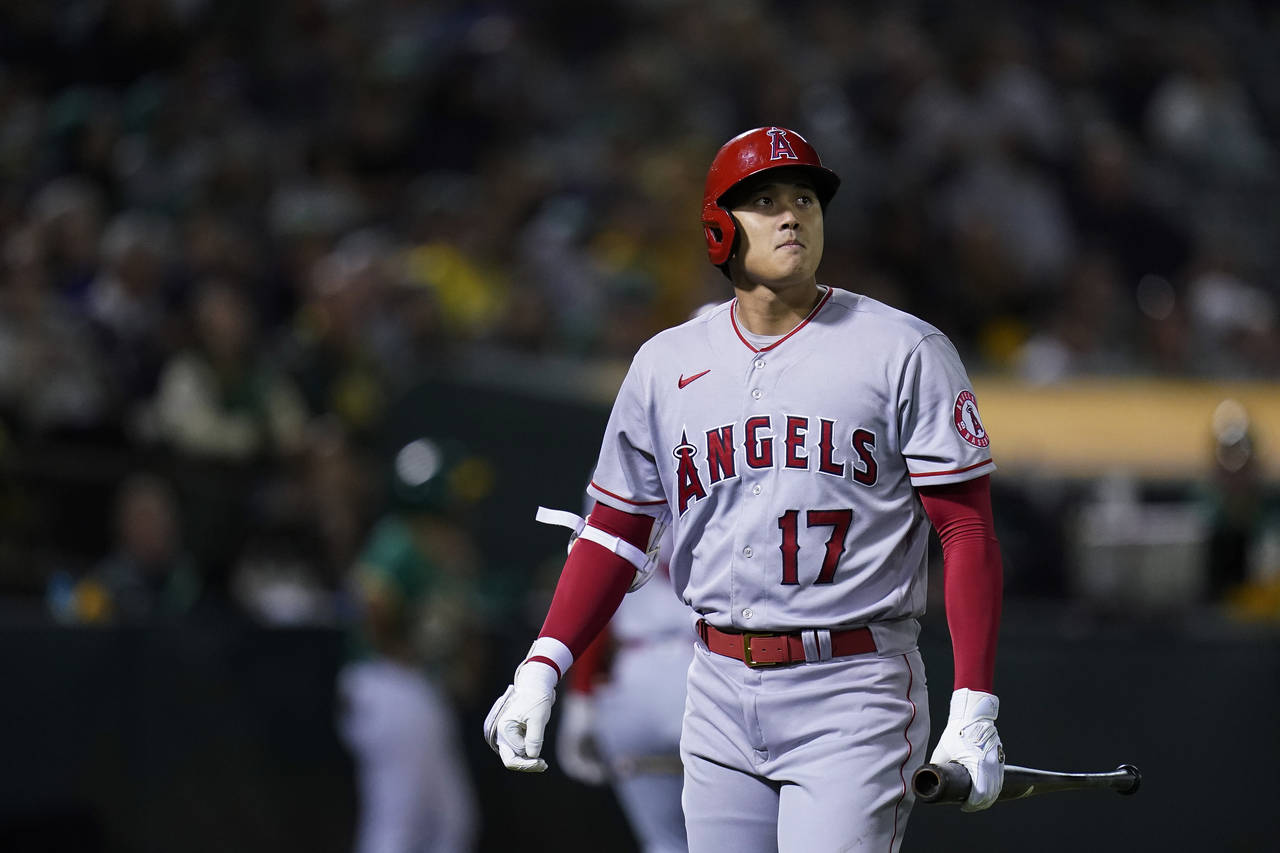 Los Angeles Angels' Shohei Ohtani walks to the dugout after striking out against the Oakland Athlet...