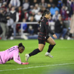 
              Portland Thorns FC forward Sophia Smith (9) gets past Kansas City Current goalie Adrianna Franch (21) en route to scoring a goal during the first half of the NWSL championship soccer match, Saturday, Oct. 29, 2022, in Washington. (AP Photo/Nick Wass) (edited)
            