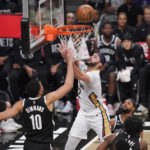 
              New Orleans Pelicans' Larry Nance Jr. (22) shoots over Brooklyn Nets' Ben Simmons (10) during the first half of an NBA basketball game Wednesday, Oct. 19, 2022, in New York. (AP Photo/Frank Franklin II)
            