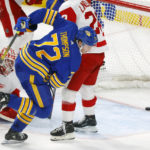 
              Buffalo Sabres right wing Tage Thompson (72) puts the puck past Detroit Red Wings goaltender Alex Nedeljkovic, left, during the third period of an NHL hockey game, Monday, Oct. 31, 2022, in Buffalo, N.Y. (AP Photo/Jeffrey T. Barnes)
            