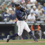 
              Seattle Mariners' Julio Rodriguez hits a solo home run on a pitch from Detroit Tigers starting pitcher Tyler Alexander during the first inning of a baseball game, Wednesday, Oct. 5, 2022, in Seattle. (AP Photo/John Froschauer)
            