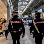 
              Carabinieri officers patrol the shopping center the day after five people were stabbed and one was killed after a man grabbed a knife from a supermarket shelf in Assago, on the outskirts of Milan, Italy, Friday Oct. 28, 2022. Police on Thursday arrested a 46-year-old Italian man suspected in the attack at a shopping center in the Milan suburb of Assago. (Claudio Furlan/LaPresse via AP)
            