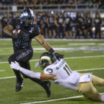 
              Nevada running back Toa Taua (35) runs away from Colorado State defensive back Henry Blackburn (11) during the first half of an NCAA college football game in Reno, Nev., Friday, Oct. 7, 2022. (AP Photo/Tom R. Smedes)
            
