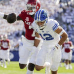 
              BYU's Puka Nacua (12) misses a pass while be defended by Arkansas' Brini Latavious (7)during an NCAA college football game Saturday, Oct. 15, 2022, in Provo, Utah. (Ben B. Braun/The Deseret News via AP)
            