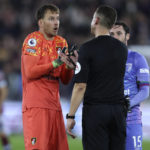 
              Bournemouth's goalkeeper Neto, left, argues with referee during their English Premier League soccer match between West Ham United and Bournemouth at the London Stadium in London, England, Monday, Oct. 24, 2022. (AP Photo/Ian Walton)
            