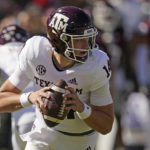 
              Texas A&M quarterback Max Johnson (14) looks for an open receiver during the first half of an NCAA college football game against Mississippi State in Starkville, Miss., Saturday, Oct. 1, 2022. (AP Photo/Rogelio V. Solis)
            