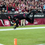 
              Arizona Cardinals cornerback Marco Wilson leaps into the end zone as he returns an inception for a touchdown during the first half of an NFL football game against the New Orleans Saints, Thursday, Oct. 20, 2022, in Glendale, Ariz. (AP Photo/Ross D. Franklin)
            