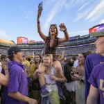 
              Fans celebrate after they came onto the field after LSU defeated Mississippi in an NCAA college football game in Baton Rouge, La., Saturday, Oct. 22, 2022. (AP Photo/Matthew Hinton)
            
