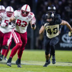 
              Nebraska tight end Travis Vokolek (83) runs for a first down in front of Purdue linebacker Kieren Douglas (43) during the second half of an NCAA college football game in West Lafayette, Ind., Saturday, Oct. 15, 2022. (AP Photo/Michael Conroy)
            
