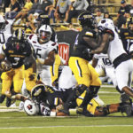 
              Southern Mississippi running back Frank Gore Jr. breaks a tackle against Arkansas State during an NCAA college football game in Hattiesburg, Miss. on Saturday, Oct. 15, 2022. (Aimee Cronan/The Gazebo Gazette via AP)
            