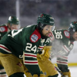 
              FILE - Minnesota Wild defenseman Matt Dumba (24), Wild right wing Mats Zuccarello (36) and Wild left wing Kirill Kaprizov (97) wait for a face off during the NHL Winter Classic hockey game Saturday, Jan. 1, 2022, at Target Field in Minneapolis. For too long, Matt Dumba felt he was on his own dealing with racial taunts directed at him as a youngster growing up in Saskatchewan. It was no different for Dumba as an adult, one of just a handful of minority players in the National Hockey League.(AP Photo/Andy Clayton-King, File)
            