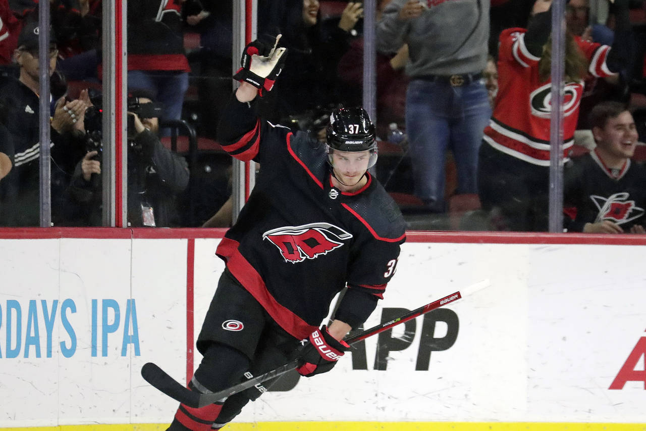 Carolina Hurricanes right wing Andrei Svechnikov (37) celebrates after he put the puck past Washing...