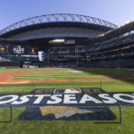 
              A logo for the baseball playoffs is on the field Friday, Oct. 14, 2022, the day before Game 3 of an AL Division Series between the Houston Astros and the Seattle Mariners in Seattle. (AP Photo/Stephen Brashear)
            